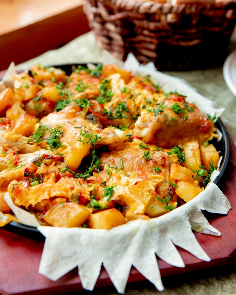 Garlic Parmesan Chicken and Potatoes – a one-pan dinner with juicy chicken, crispy roasted potatoes, Parmesan cheese, and garlic seasoning, perfect for a quick and flavorful meal
